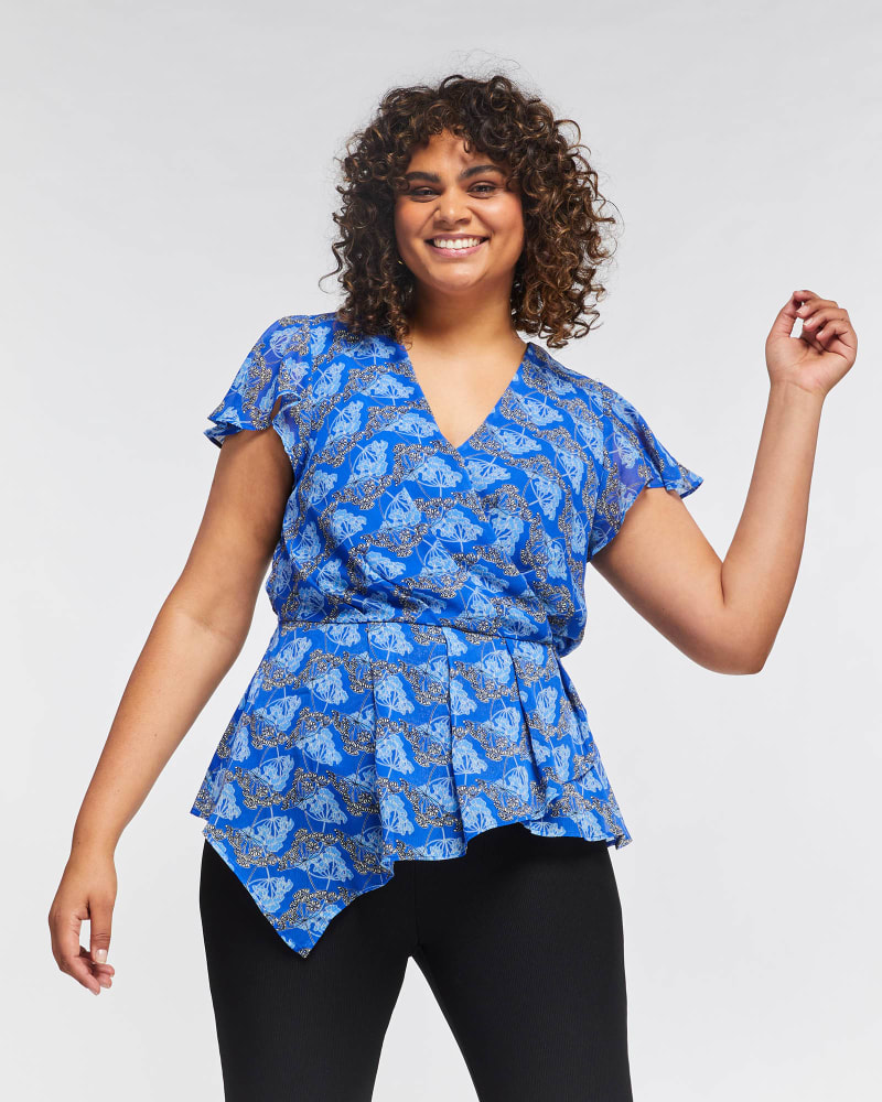 Front of a model wearing a size 3X Spring Floral Top in Print by Estelle. | dia_product_style_image_id:264785